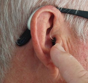 person wearing silver framed eyeglasses