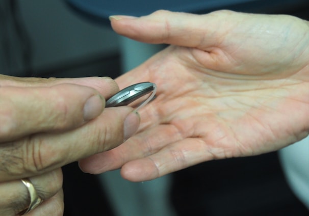 person holding silver nail cutter