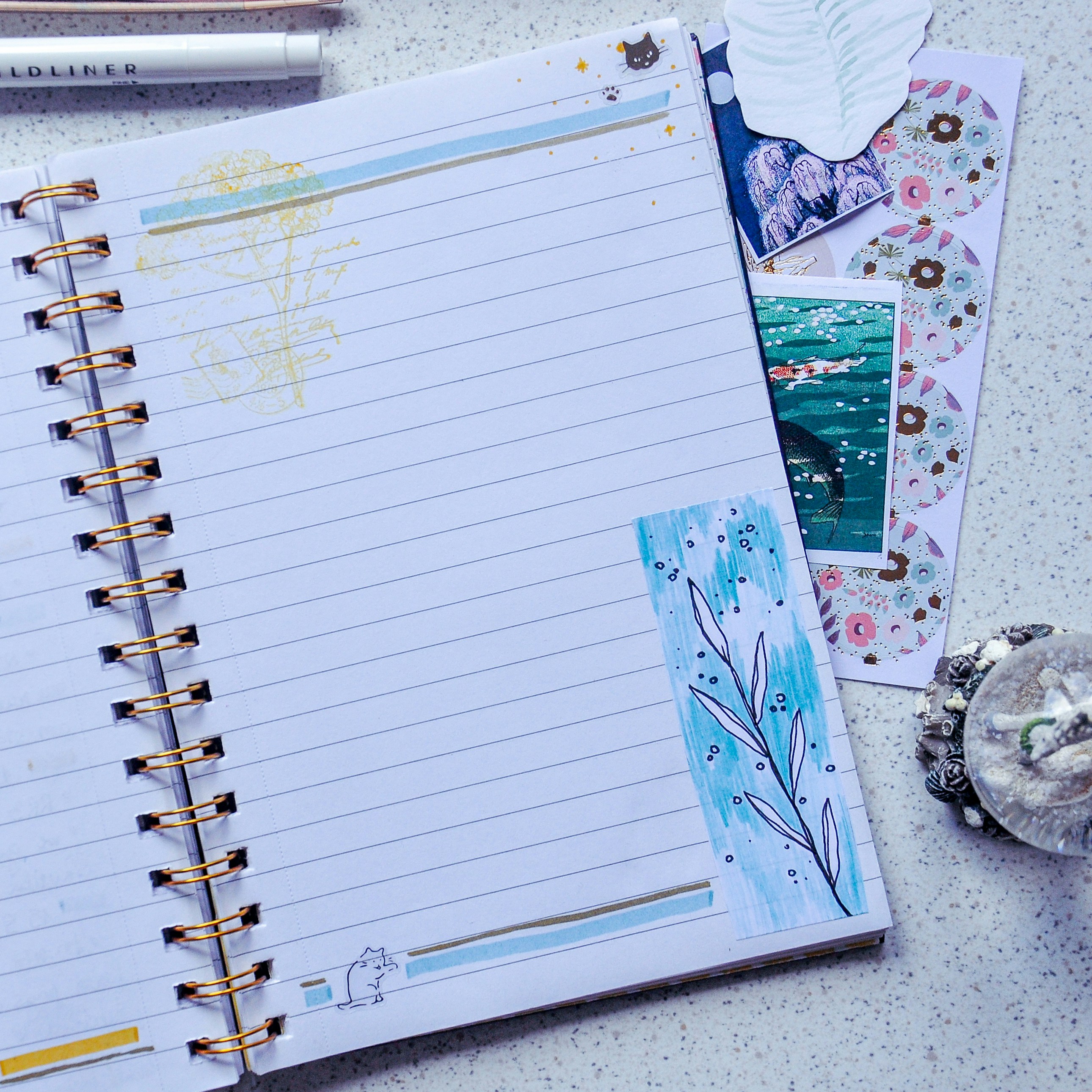 white ruled paper on white and gray table