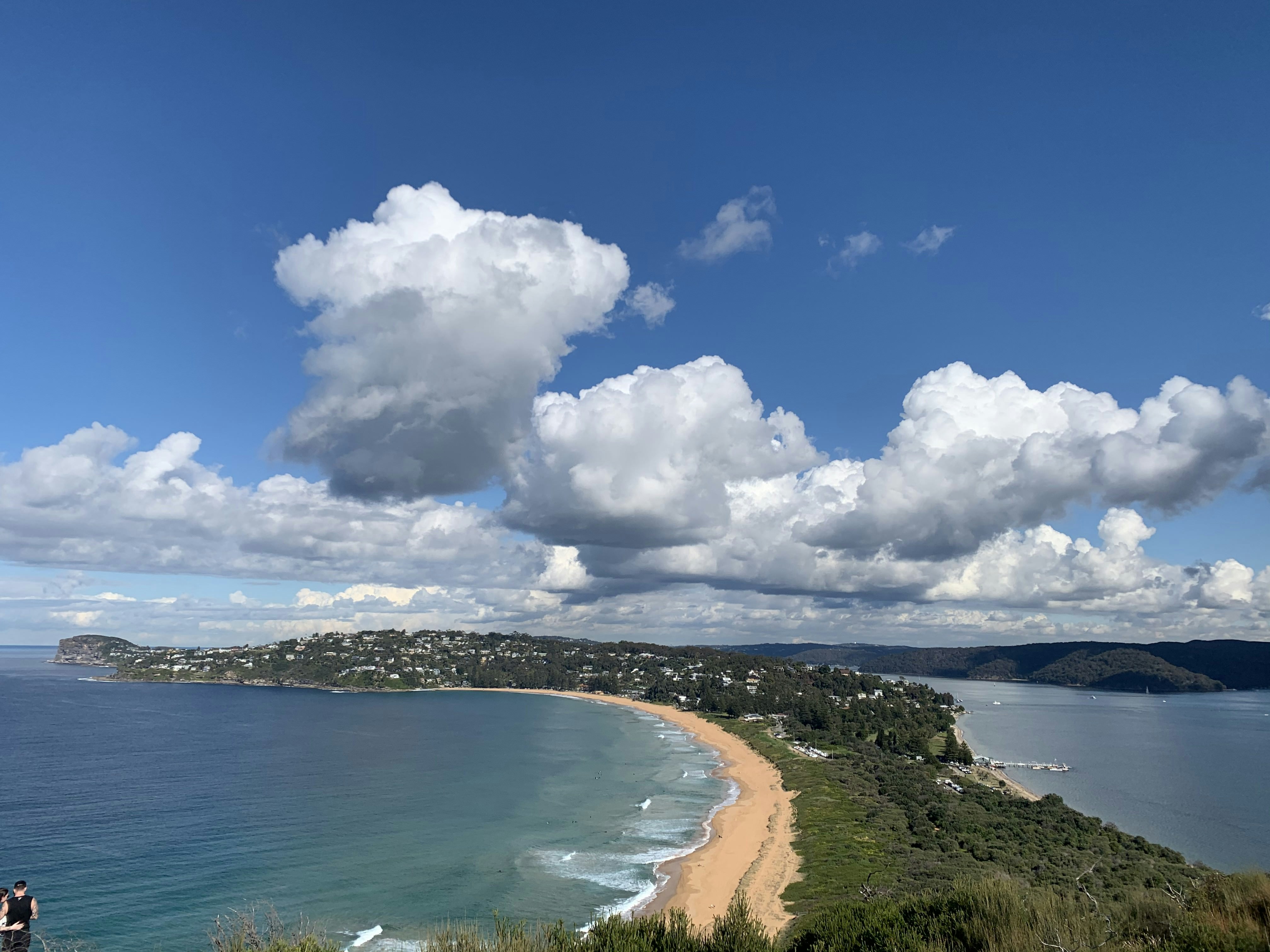 white clouds over blue sea