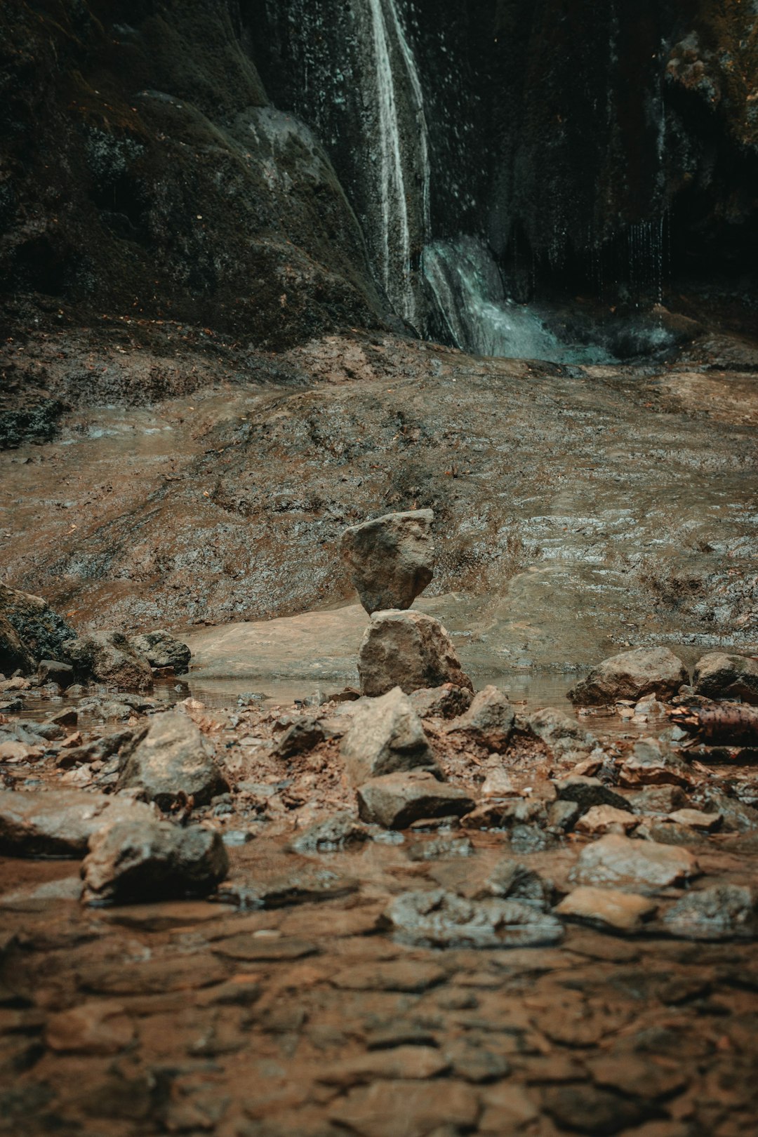 brown rock formation near waterfalls during daytime