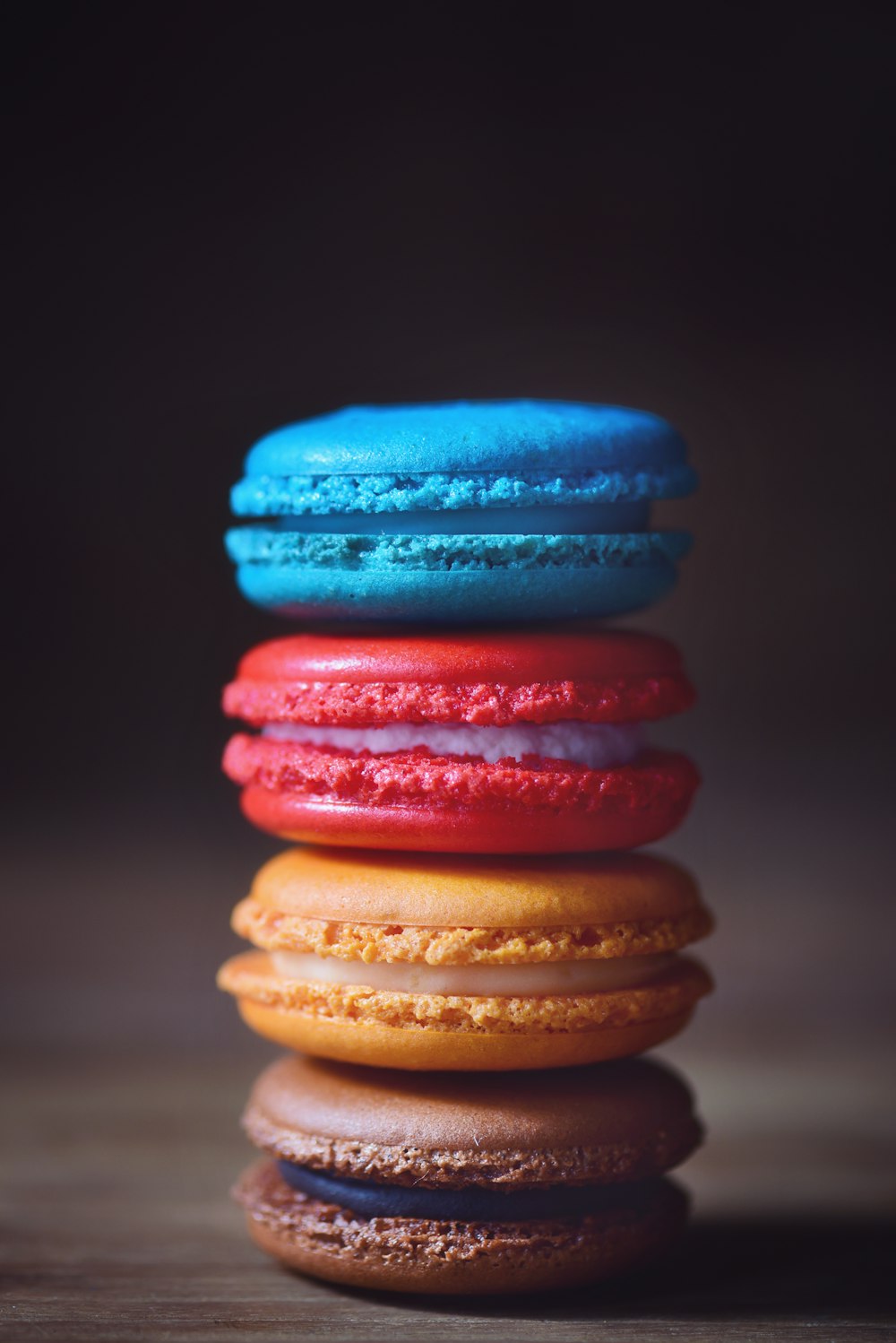 a stack of colorful macaroons sitting on top of each other