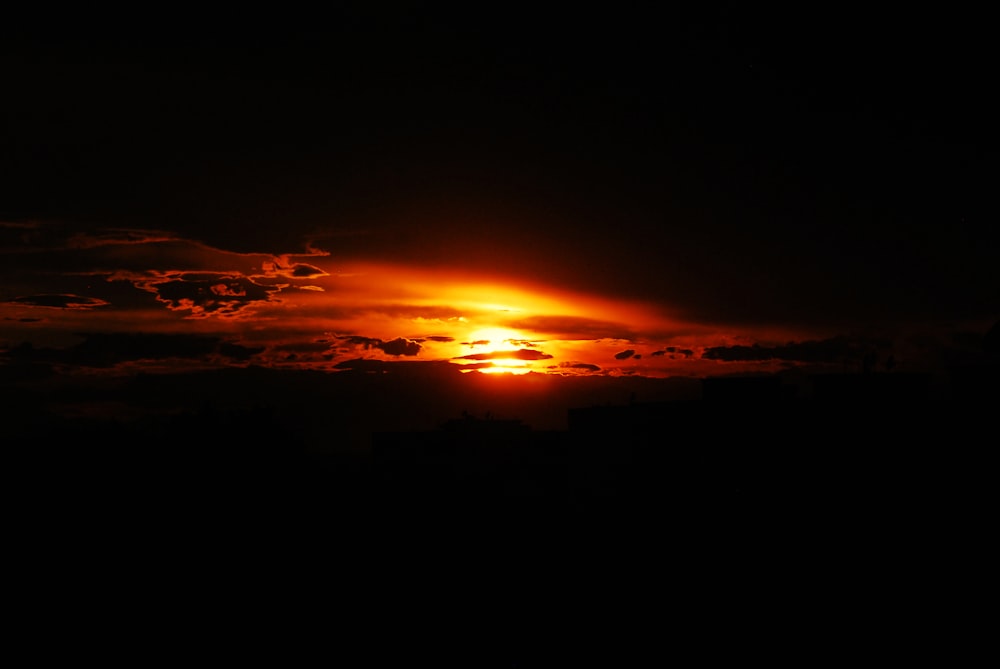 sunset over the clouds and mountain