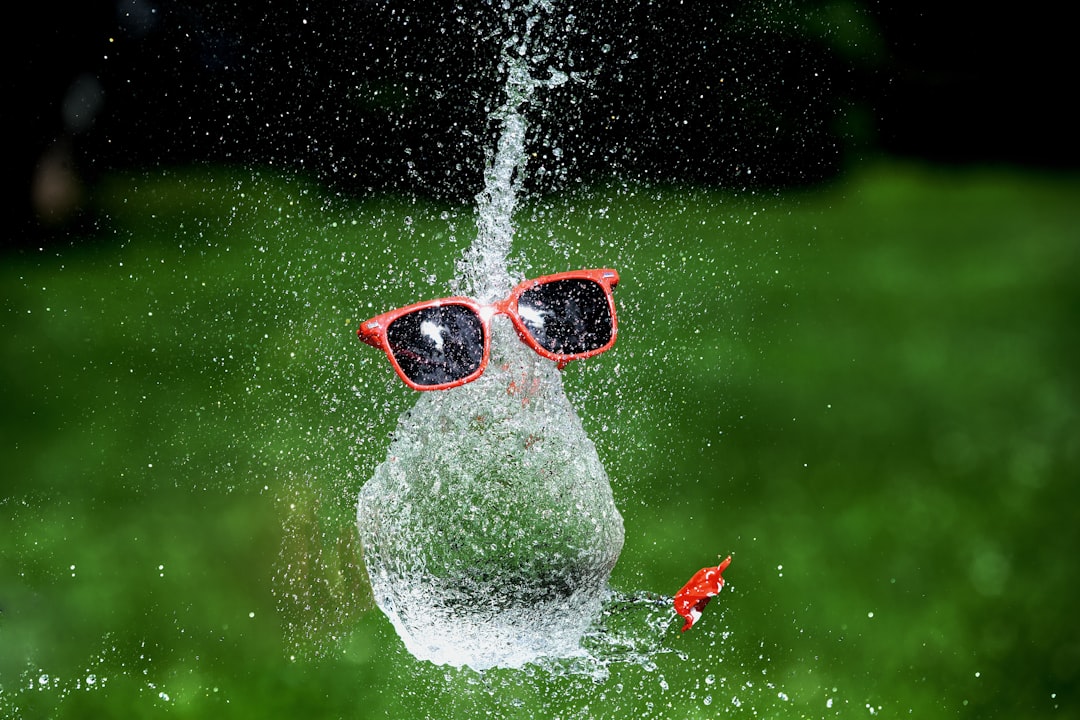 water splash with red framed sunglasses