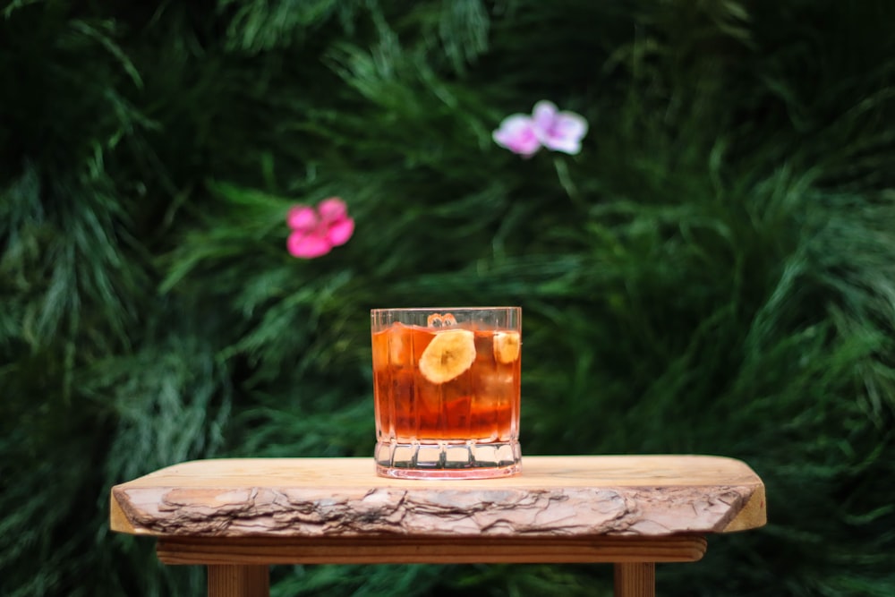 clear drinking glass on brown wooden table