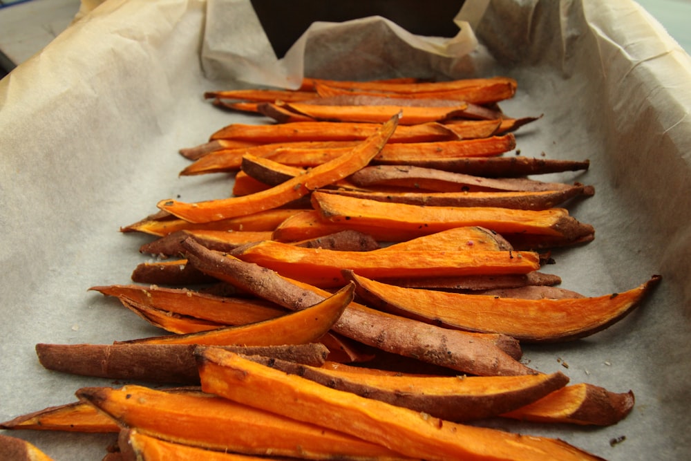 sliced carrots on white paper