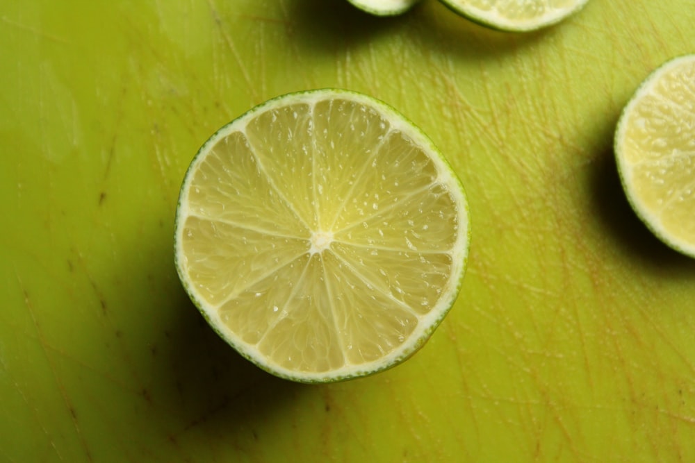 sliced lemon on brown wooden table