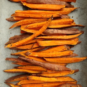 sliced carrots on gray surface