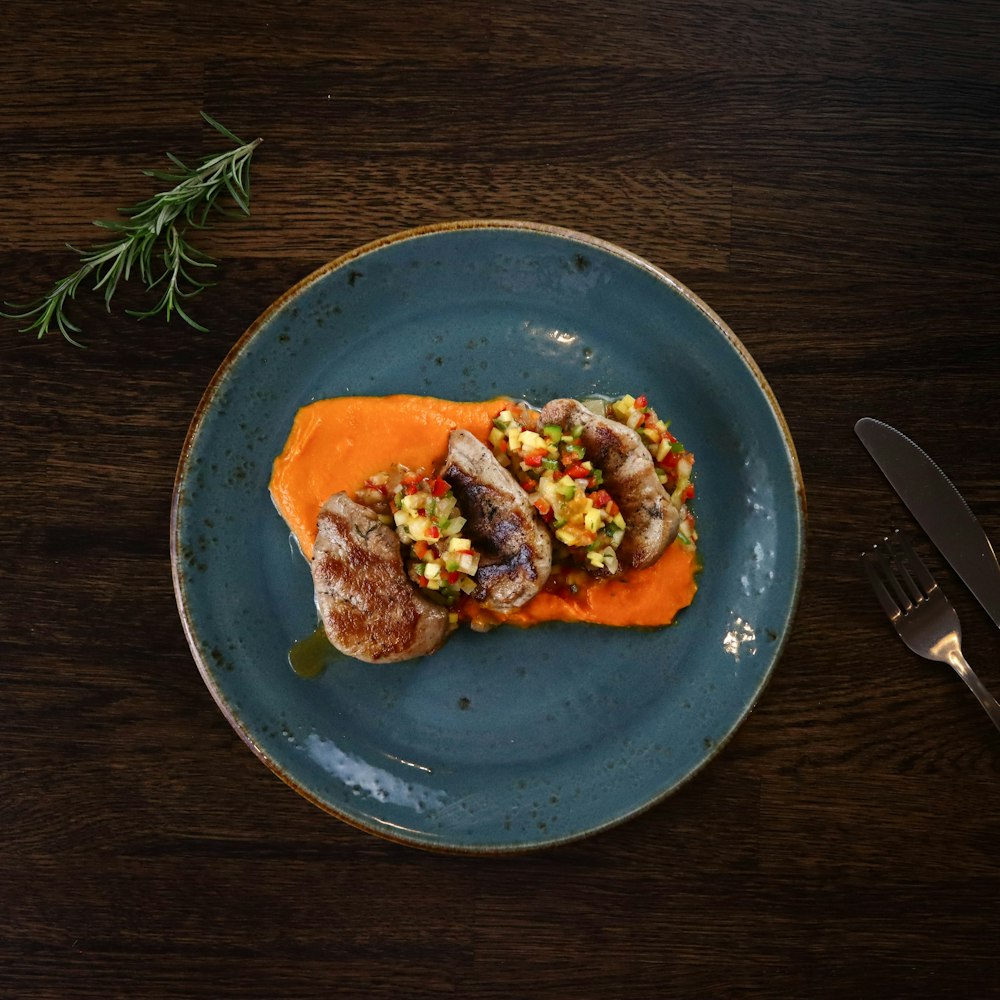 cooked food on blue ceramic plate