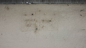 Close-up aerial shot of a beach volleyball match with players diving for the ball.