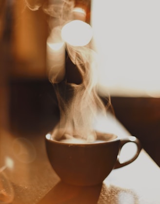 brown ceramic cup with white smoke