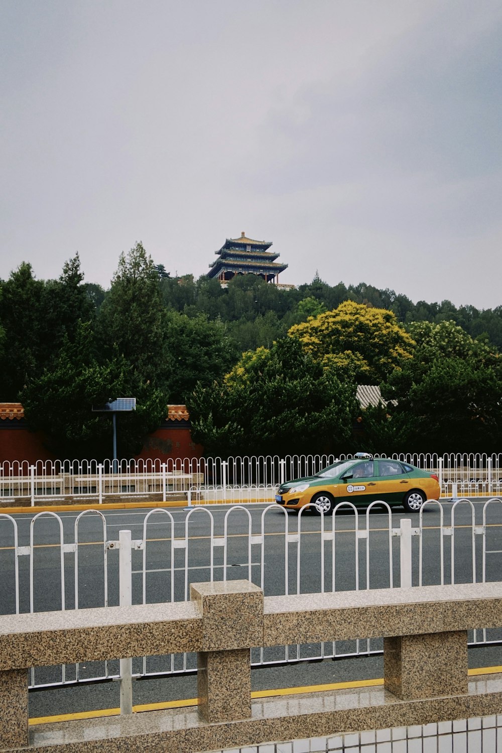 yellow and black coupe on road during daytime