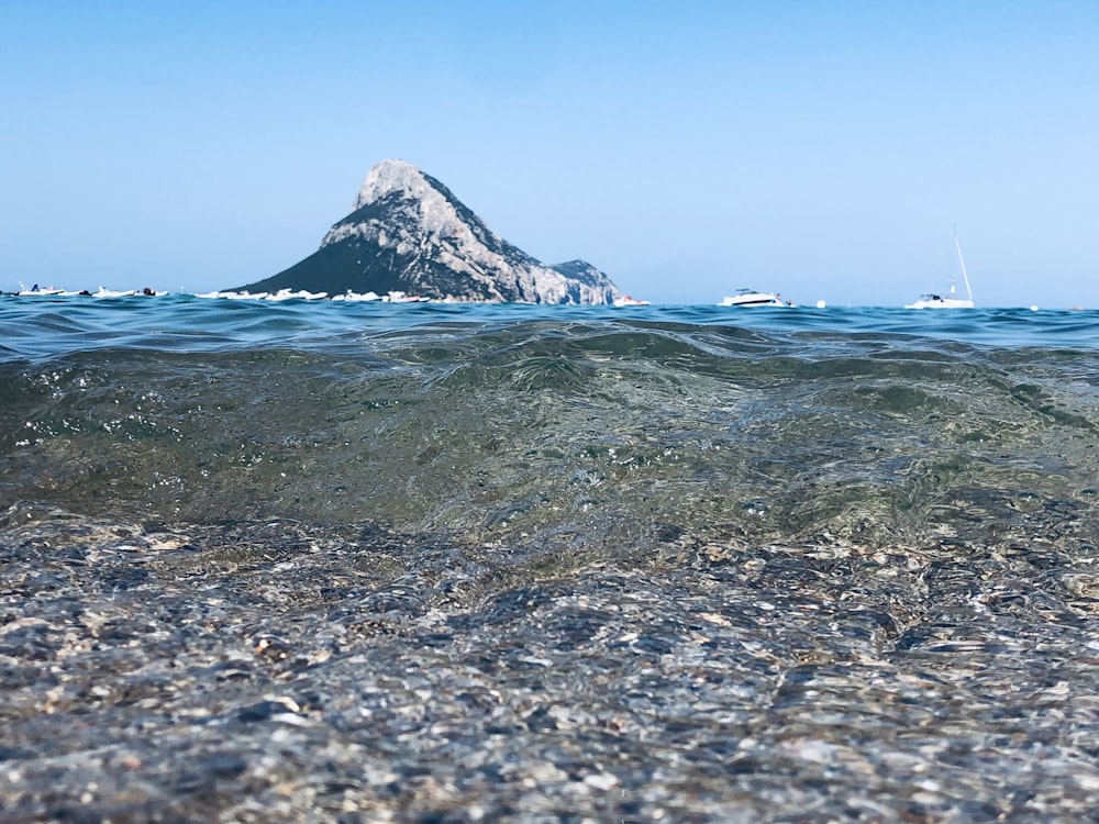 ocean waves crashing on shore during daytime