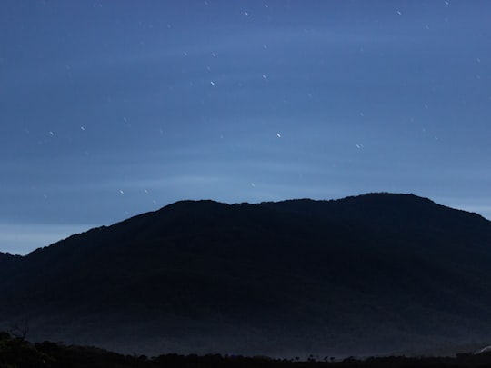 silhouette of mountain under blue sky during night time in Wilsons Promontory VIC Australia