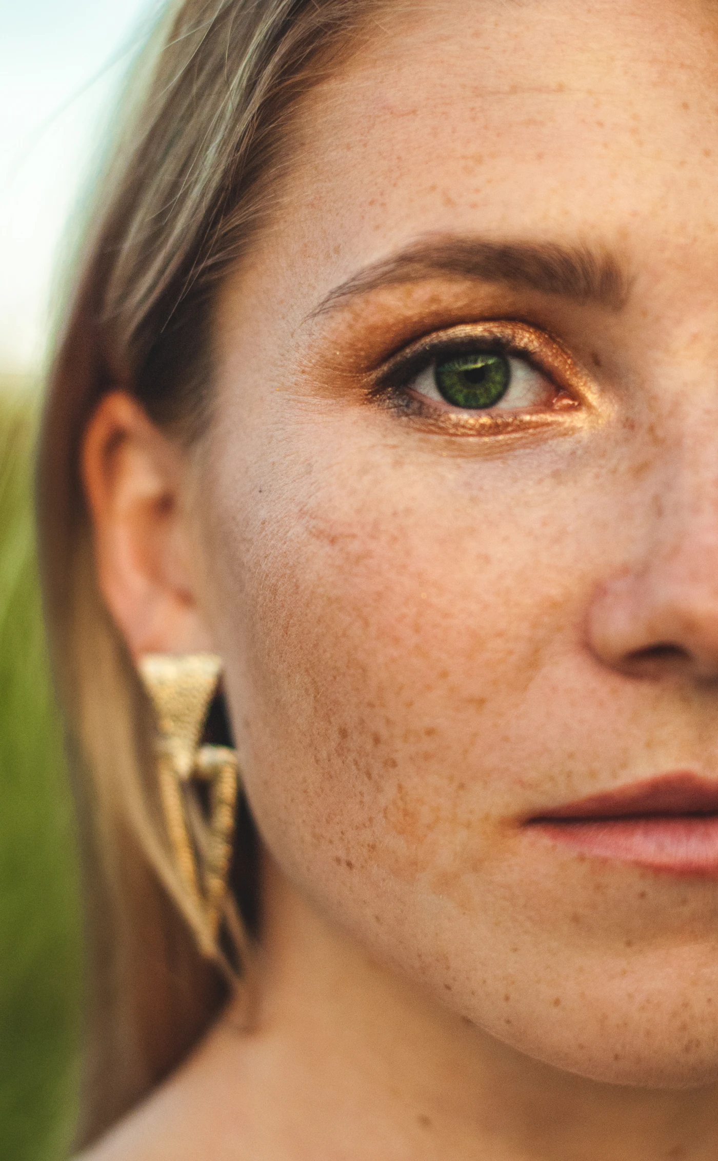 Woman wearing gold hoop earrings