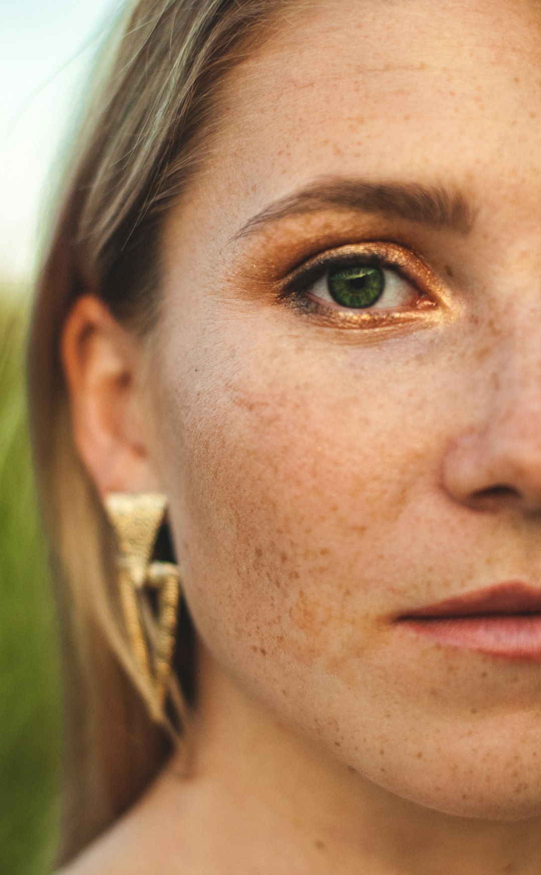 woman in gold hoop earrings