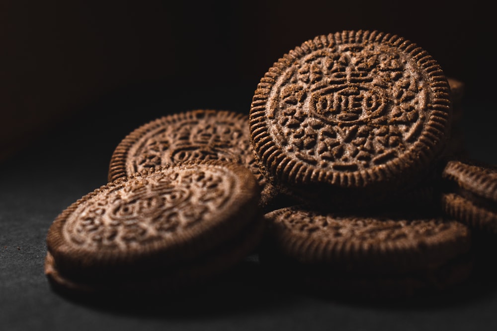 brown cookies on black surface