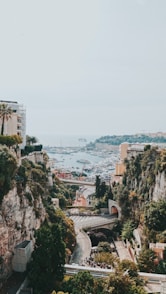 aerial view of city buildings near body of water during daytime