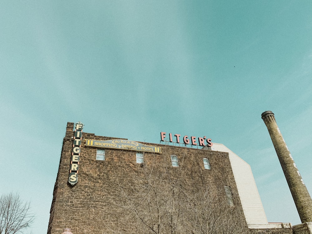 brown brick building under blue sky during daytime