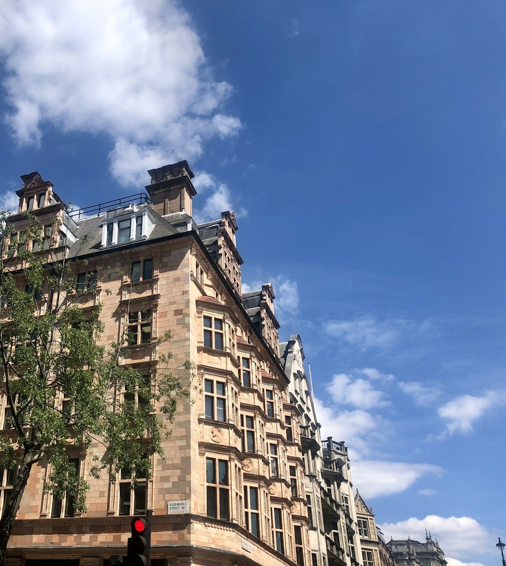 brown concrete building under blue sky during daytime