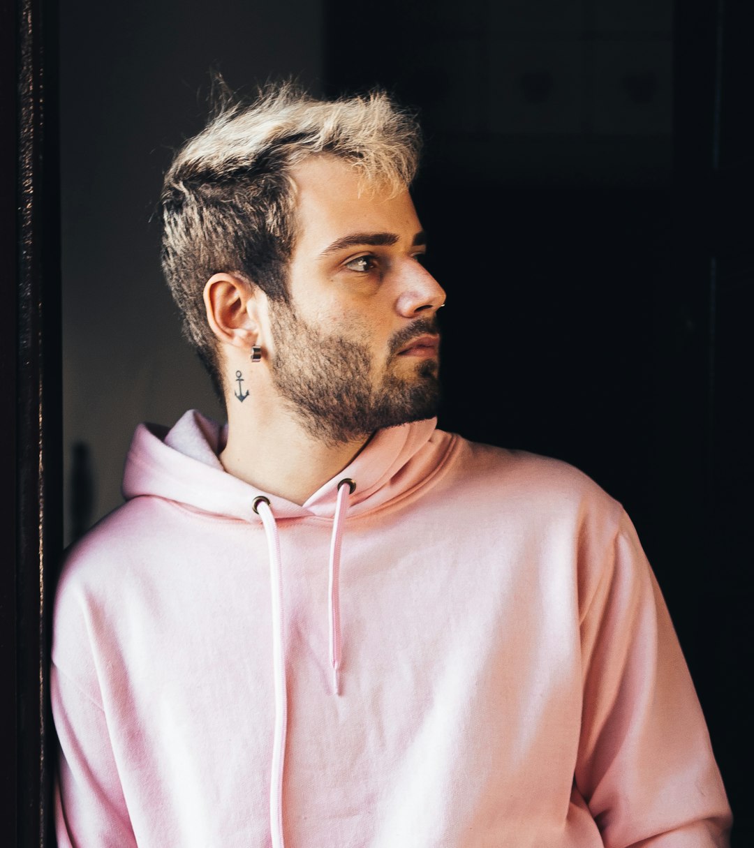 man in pink pullover hoodie