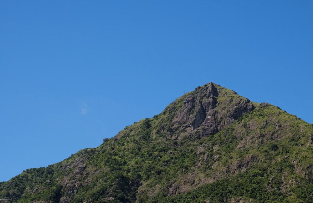 green and gray mountain under blue sky during daytime