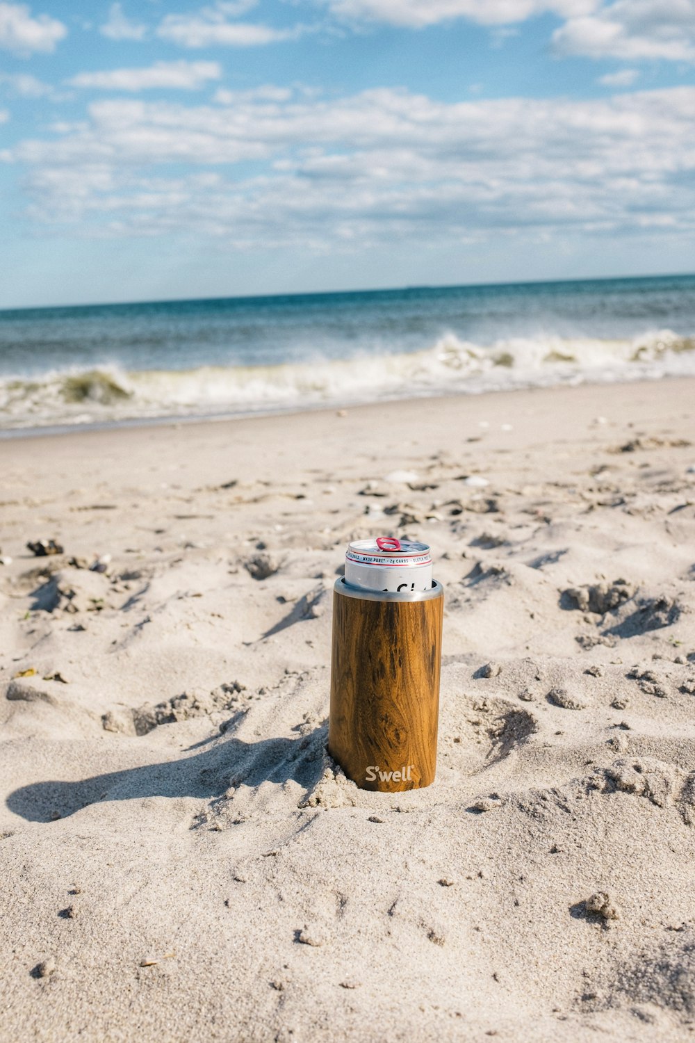 brown wooden post on beach during daytime