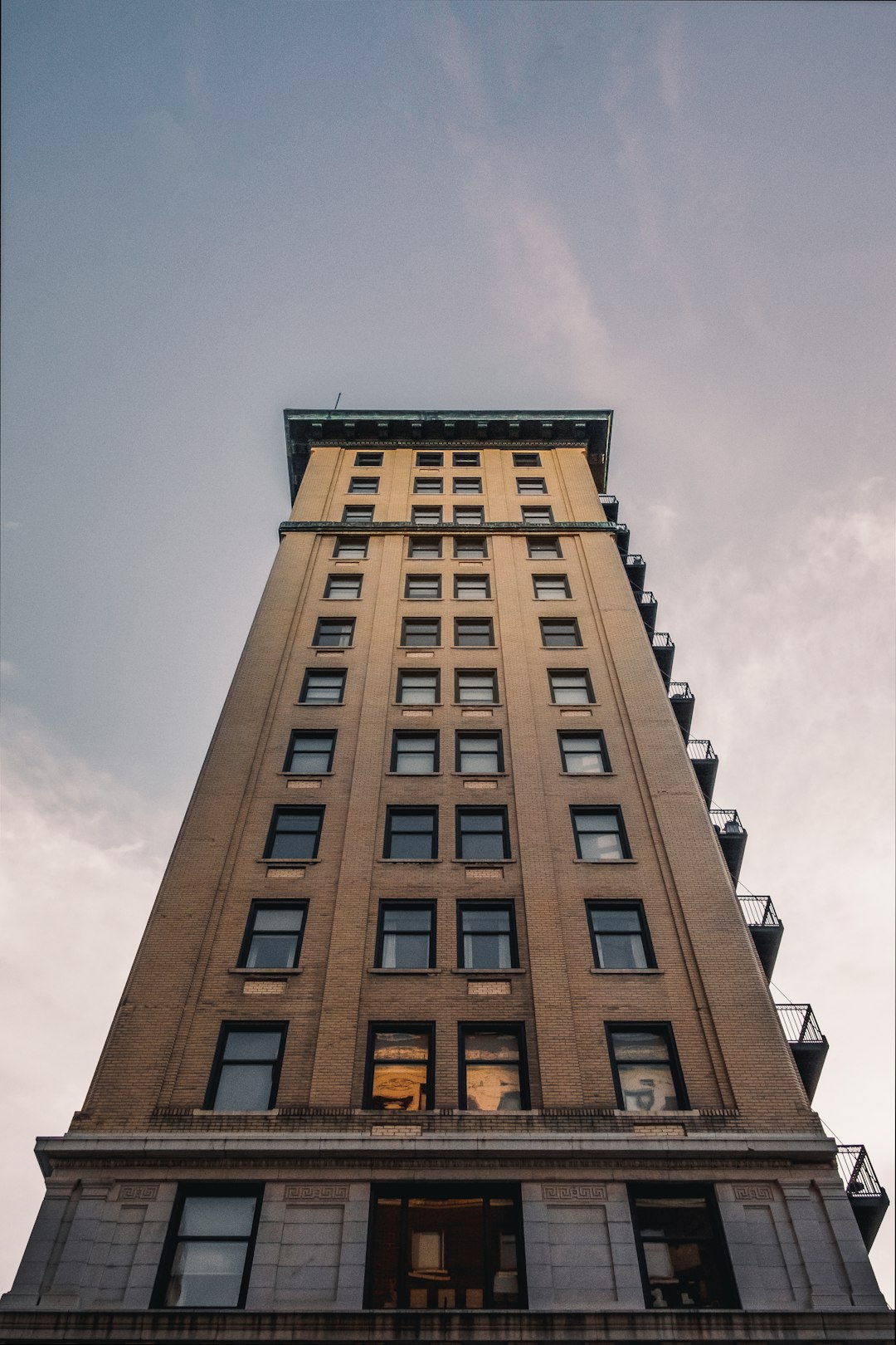 brown concrete building under blue sky during daytime