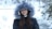woman in black jacket and gray fur scarf