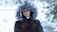 woman in black jacket and gray fur scarf