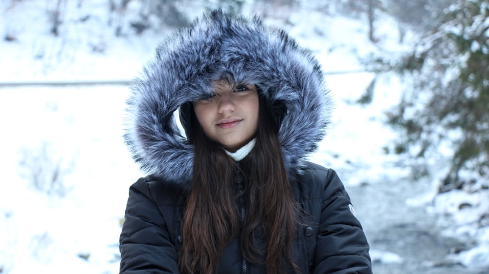 woman in black jacket and gray fur scarf