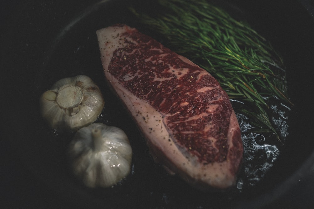 raw meat on black plate