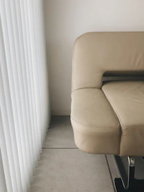 Elegant leather sofa with sleek lines in a minimalist setting.