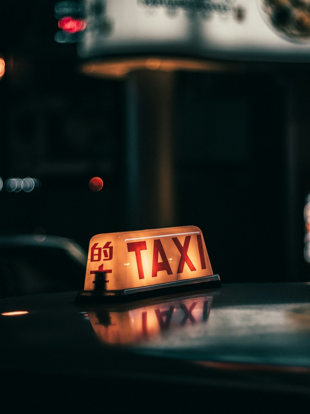 yellow and black taxi sign