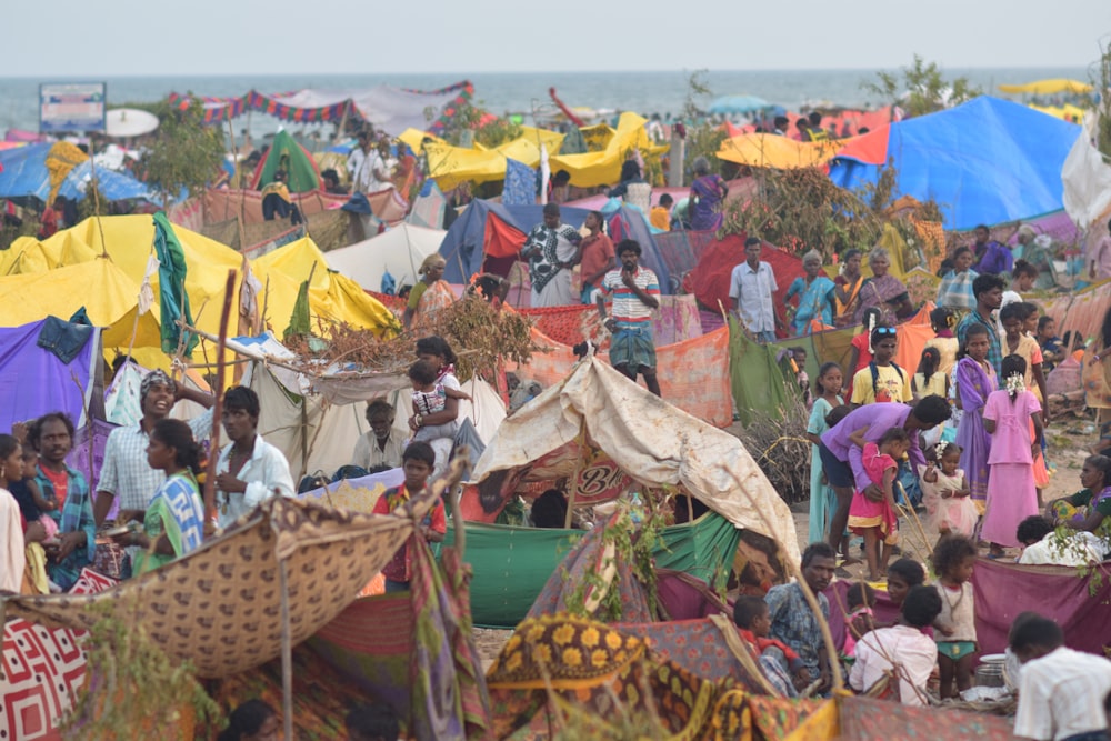 people gathering on beach during daytime