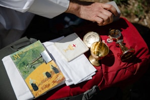 Hands holding a nazar protection kit gently wrapped in a red cloth