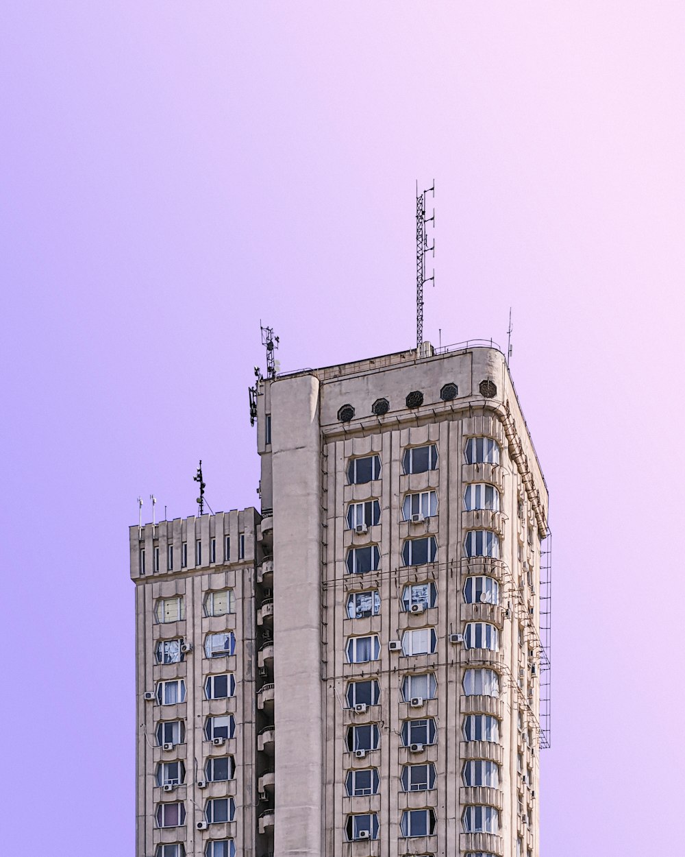 white concrete building under blue sky during daytime