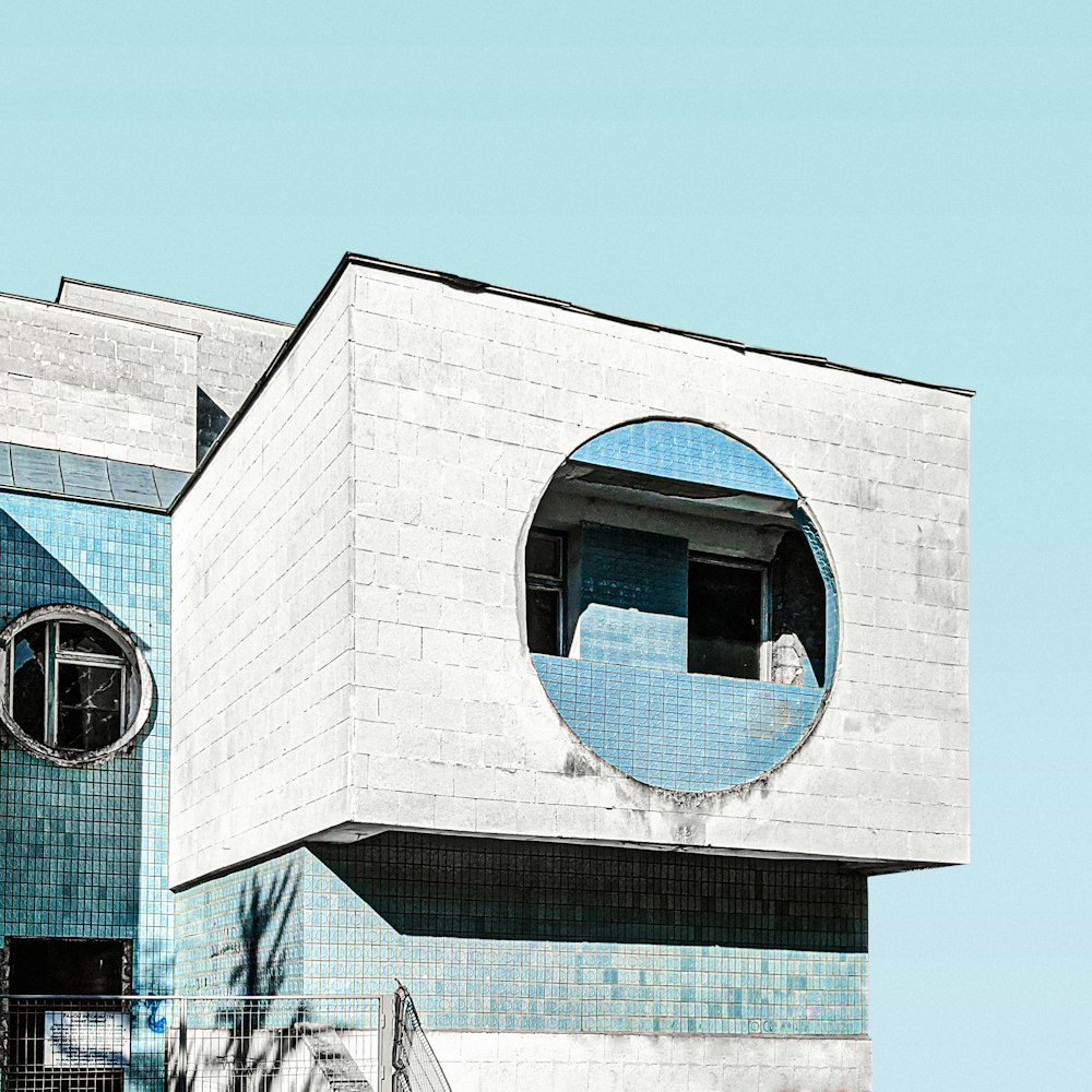 white concrete building with glass window