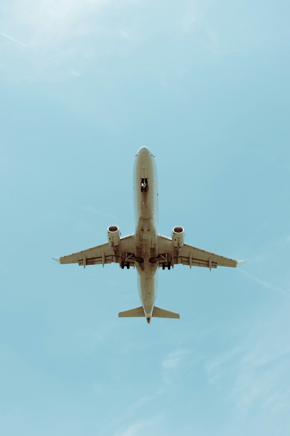 white and blue airplane in the sky