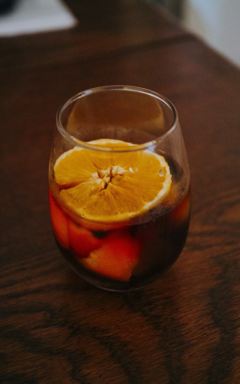 orange juice in clear drinking glass