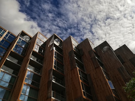 A modern mass timber building under construction in downtown Vancouver, showcasing sustainable architecture.