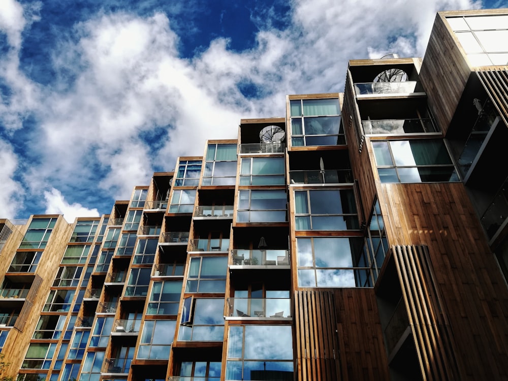 brown and white concrete building under blue sky during daytime