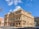 beige concrete building under blue sky during daytime