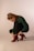 woman in green long sleeve shirt and red boots sitting on white floor