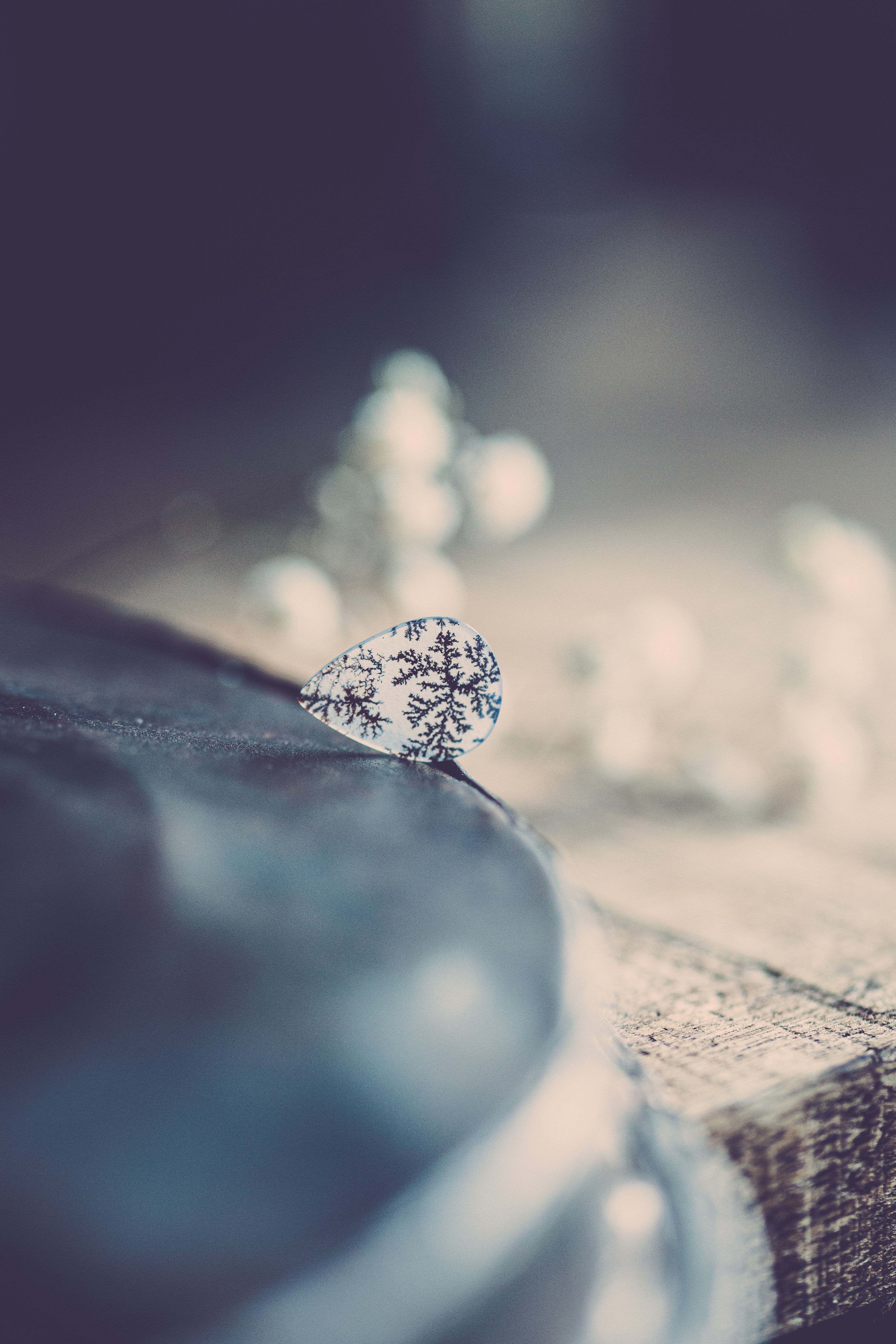 water droplets on brown wooden surface