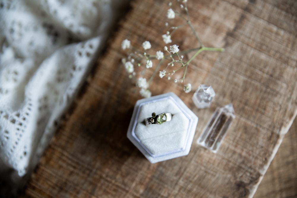 white flower on clear glass container
