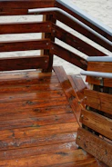 Side-by-side images showing a deck before and after pressure washing, highlighting the wood’s natural color.