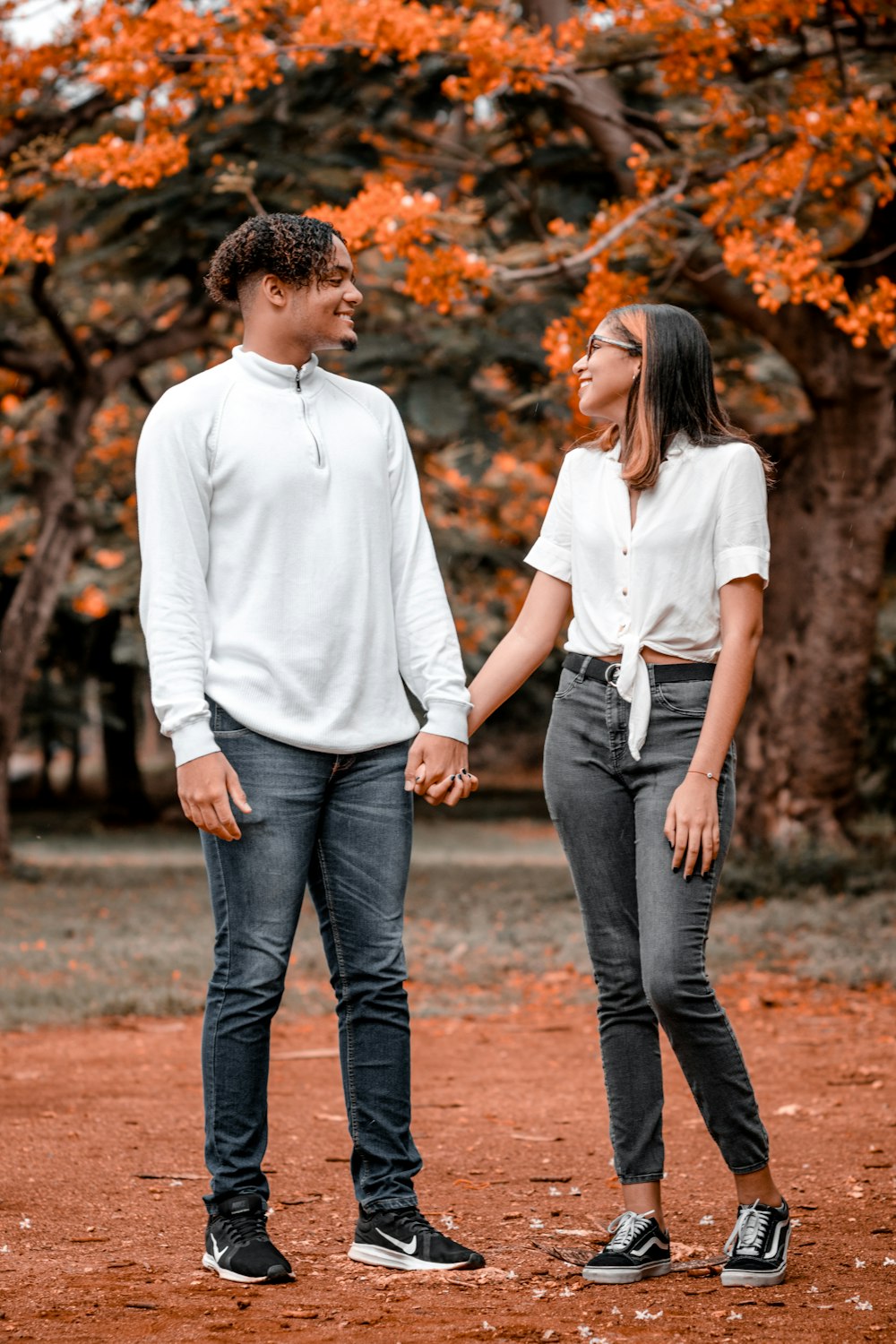 man in white polo shirt and woman in white long sleeve shirt