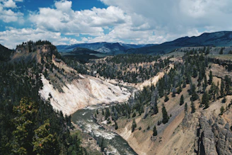A panoramic shot of the beautiful Sianok Canyon with its steep cliffs and winding river below.