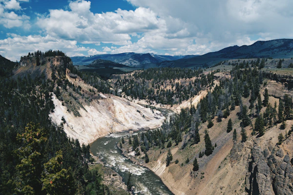 A panoramic shot of the beautiful Sianok Canyon with its steep cliffs and winding river below.